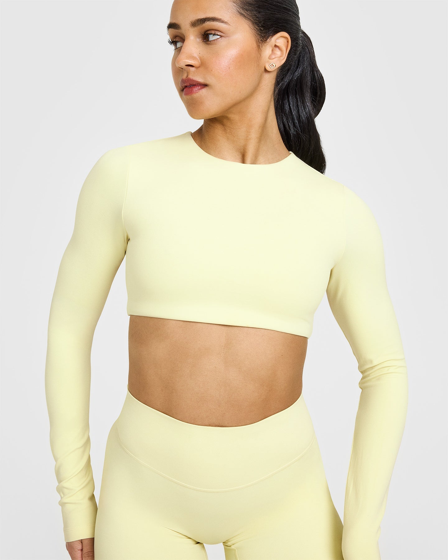 SoftMotionâ„¢ Long Sleeve Crop Top with White Logo | Pastel Yellow