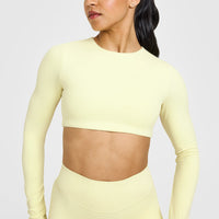 SoftMotionâ„¢ Long Sleeve Crop Top with White Logo | Pastel Yellow