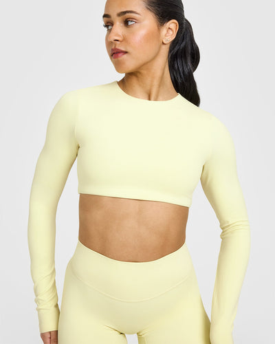 SoftMotionâ„¢ Long Sleeve Crop Top with White Logo | Pastel Yellow