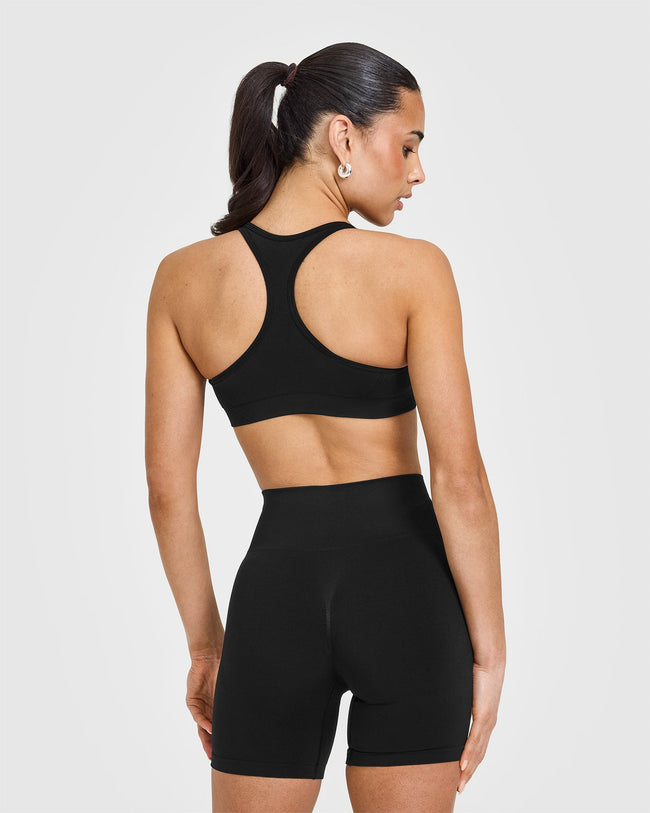 Effortless Seamless Racer Back Sports Bra with White Logo | Black