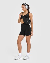 Effortless Seamless Racer Back Sports Bra with White Logo | Black