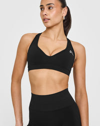 Effortless Seamless Racer Back Sports Bra with White Logo | Black