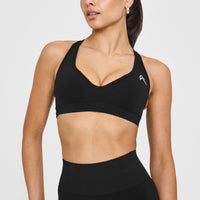 Effortless Seamless Racer Back Sports Bra with White Logo | Black