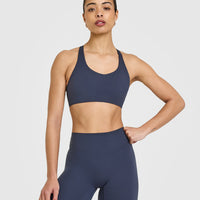 SoftMotionâ„¢ Sports Bra with White Logo | True Blue