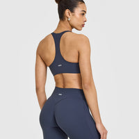 SoftMotionâ„¢ Sports Bra with White Logo | True Blue