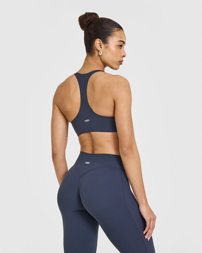 SoftMotionâ„¢ Sports Bra with White Logo | True Blue
