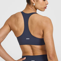 SoftMotionâ„¢ Sports Bra with White Logo | True Blue