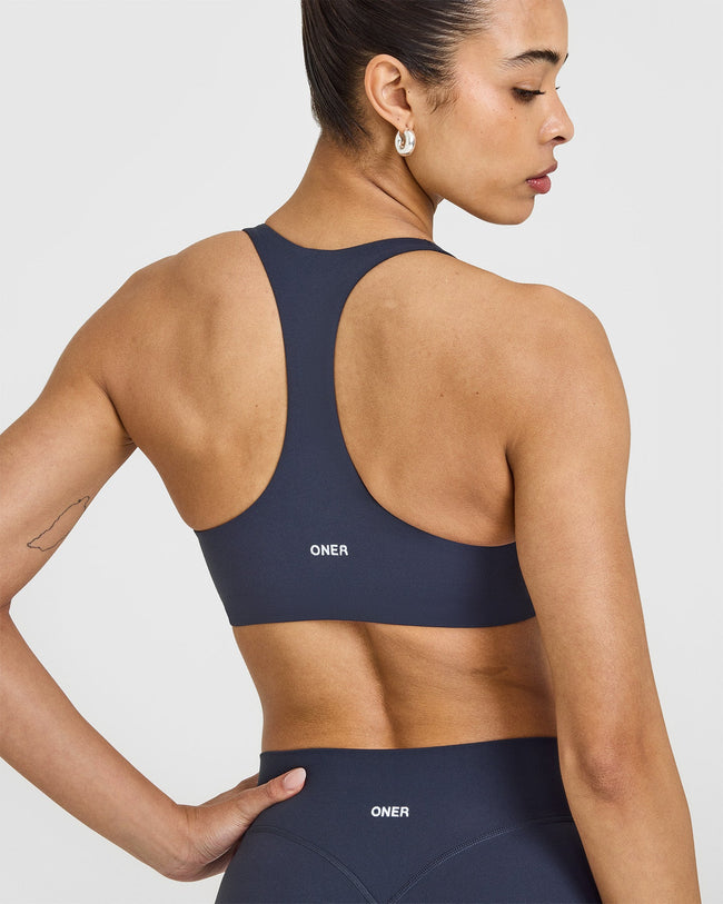 SoftMotionâ„¢ Sports Bra with White Logo | True Blue