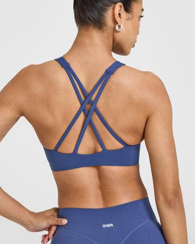 EasyLiftâ„¢ High Neck Sports Bra with White Logo | Shadow Blue