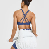 EasyLiftâ„¢ High Neck Sports Bra with White Logo | Shadow Blue