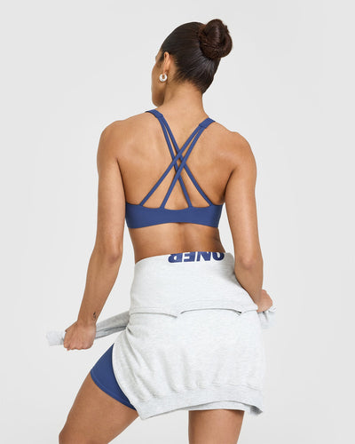 EasyLiftâ„¢ High Neck Sports Bra with White Logo | Shadow Blue