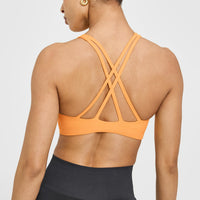 EasyLiftâ„¢ High Neck Sports Bra with White Logo | Powdered Orange