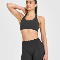 SoftMotionâ„¢ Sports Bra with White Logo | Soft Black