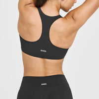 SoftMotionâ„¢ Sports Bra with White Logo | Soft Black