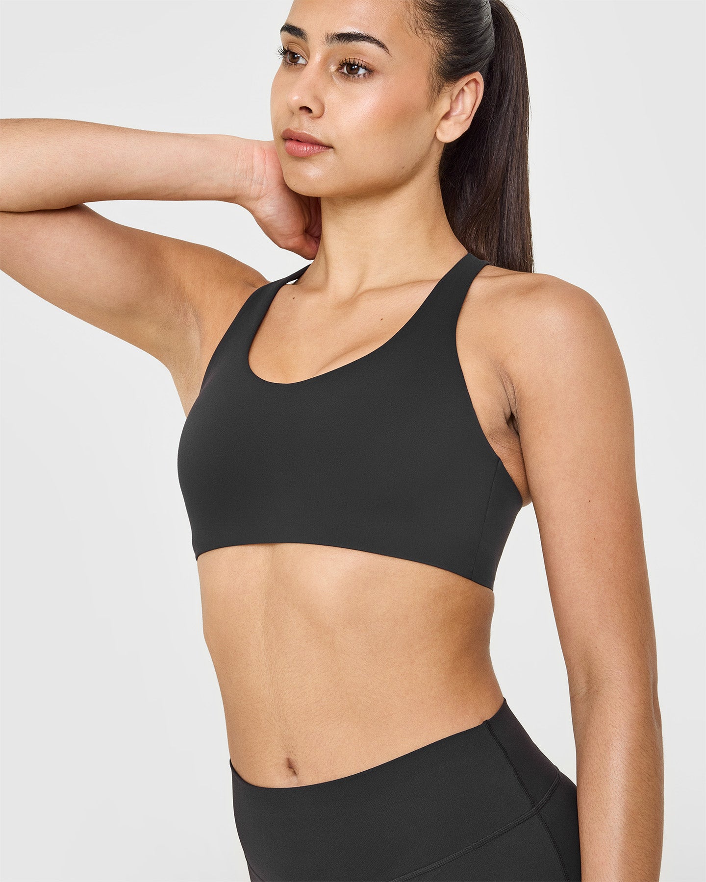 SoftMotionâ„¢ Sports Bra with White Logo | Soft Black