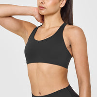SoftMotionâ„¢ Sports Bra with White Logo | Soft Black
