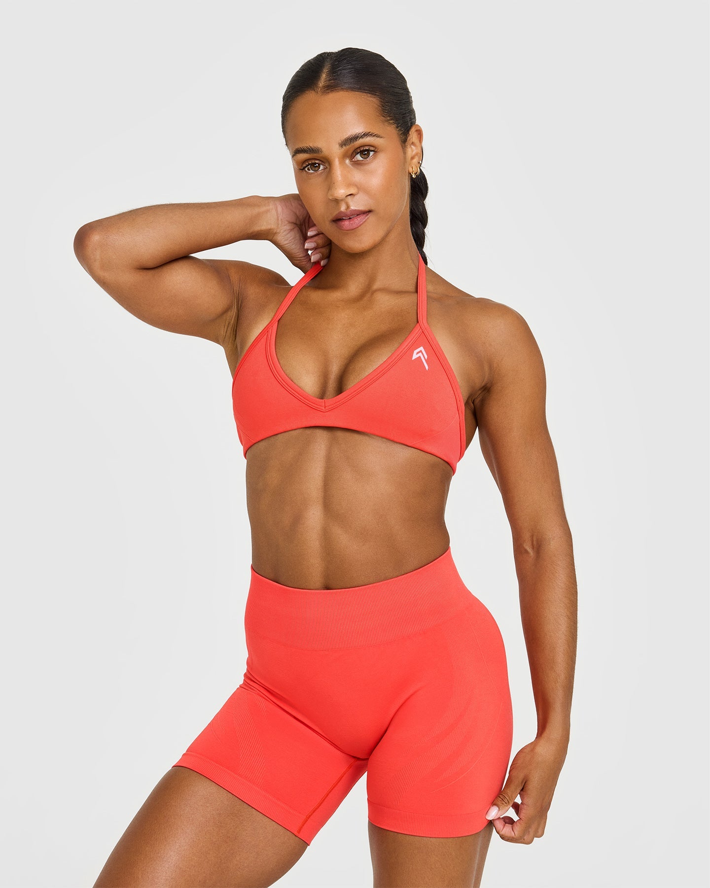 EnhanceLiftâ„¢ Seamless Minimal Halter Neck Bralette with White Logo | Charged Coral