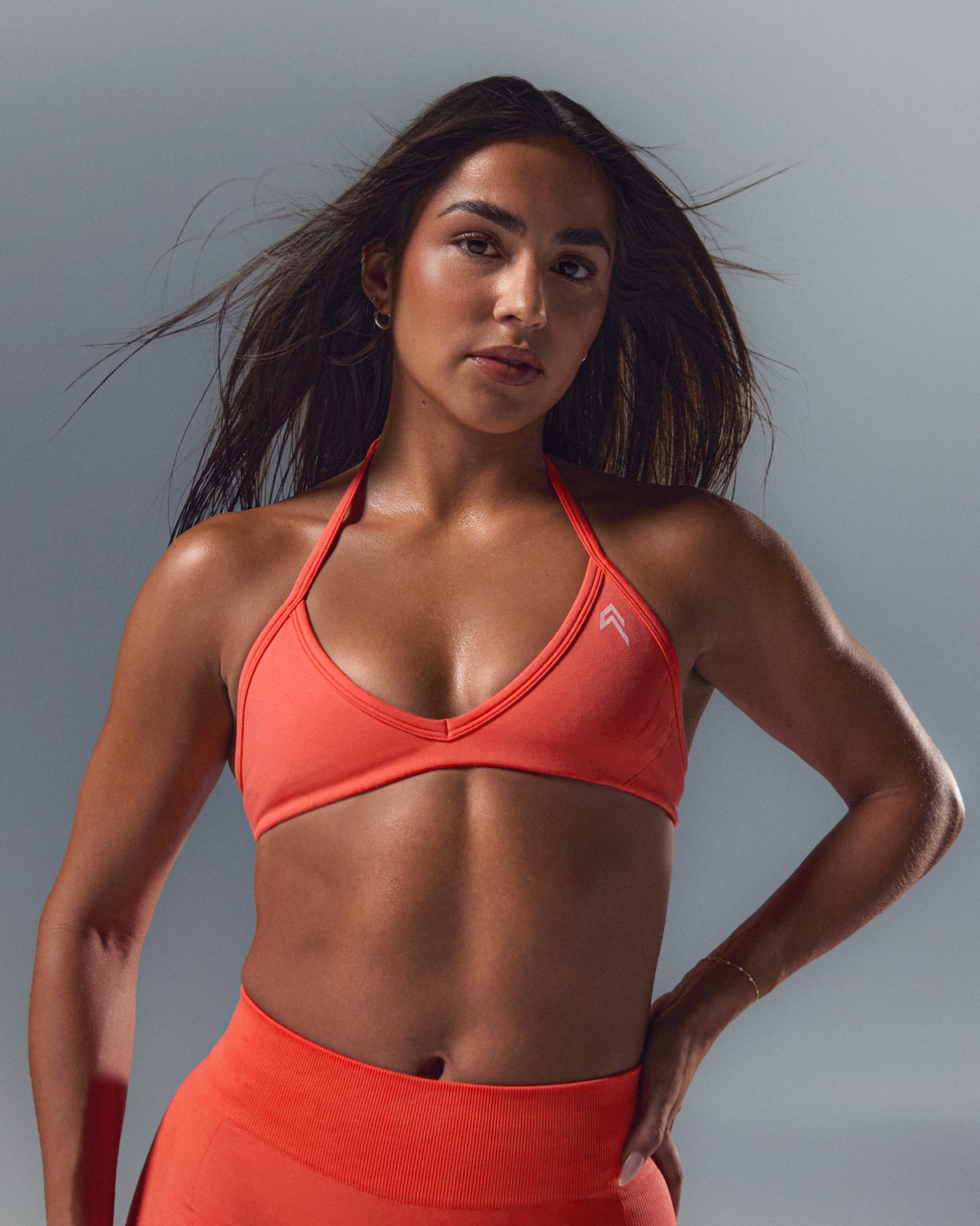 EnhanceLiftâ„¢ Seamless Minimal Halter Neck Bralette with White Logo | Charged Coral