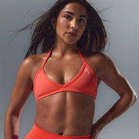 EnhanceLiftâ„¢ Seamless Minimal Halter Neck Bralette with White Logo | Charged Coral