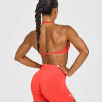 EnhanceLiftâ„¢ Seamless Minimal Halter Neck Bralette with White Logo | Charged Coral