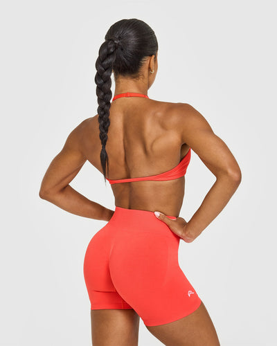 EnhanceLiftâ„¢ Seamless Minimal Halter Neck Bralette with White Logo | Charged Coral