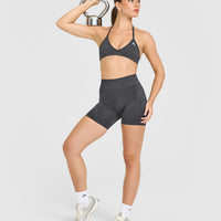 EnhanceLiftâ„¢ Seamless Minimal Halter Neck Bralette with White Logo | Coal