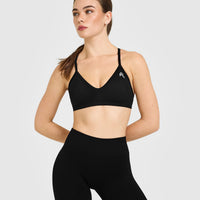 EnhanceLiftâ„¢ Seamless Strappy Sports Bra with White Logo | Black
