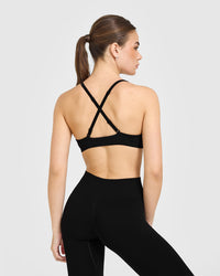 EnhanceLiftâ„¢ Seamless Strappy Sports Bra with White Logo | Black