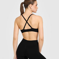 EnhanceLiftâ„¢ Seamless Strappy Sports Bra with White Logo | Black
