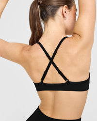 EnhanceLiftâ„¢ Seamless Strappy Sports Bra with White Logo | Black