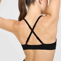 EnhanceLiftâ„¢ Seamless Strappy Sports Bra with White Logo | Black