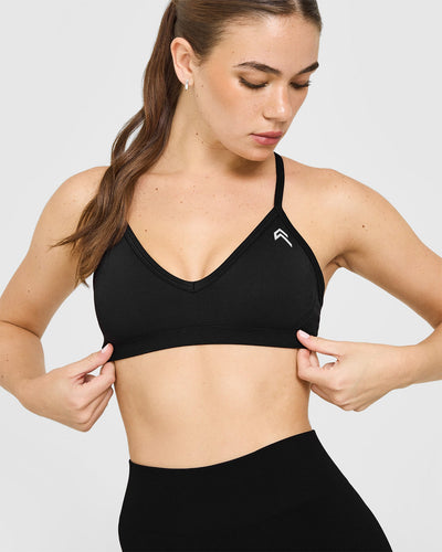 EnhanceLiftâ„¢ Seamless Strappy Sports Bra with White Logo | Black