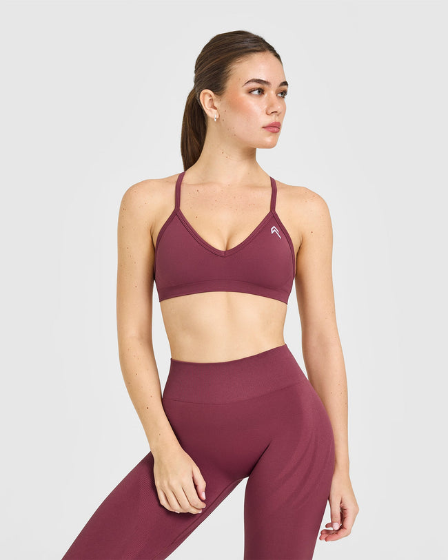 EnhanceLiftâ„¢ Seamless Strappy Sports Bra with White Logo | Burnt Maroon