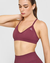 EnhanceLiftâ„¢ Seamless Strappy Sports Bra with White Logo | Burnt Maroon