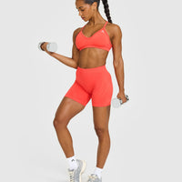 EnhanceLiftâ„¢ Seamless Strappy Sports Bra with White Logo | Charged Coral