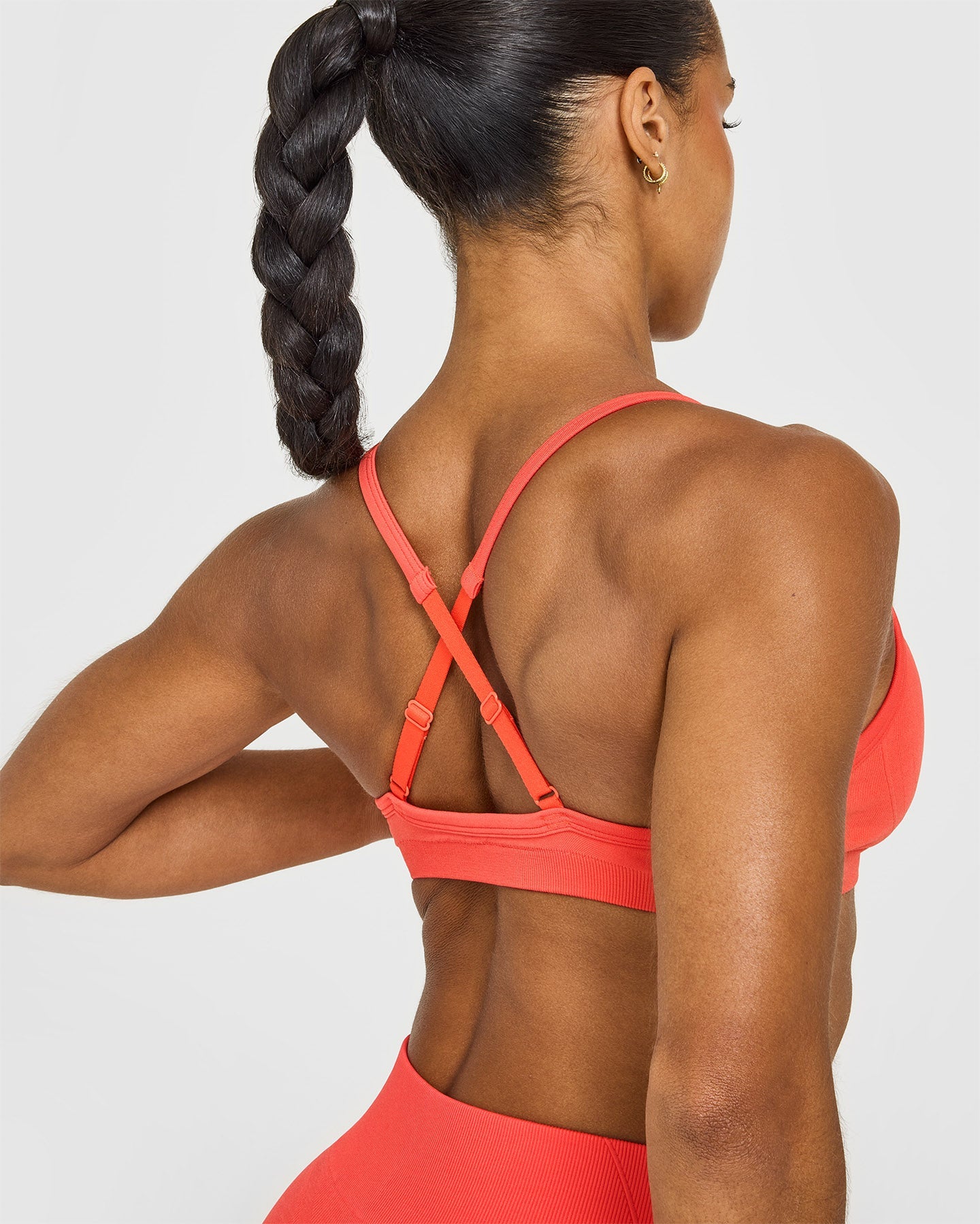 EnhanceLiftâ„¢ Seamless Strappy Sports Bra with White Logo | Charged Coral