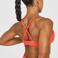 EnhanceLiftâ„¢ Seamless Strappy Sports Bra with White Logo | Charged Coral