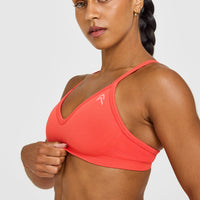EnhanceLiftâ„¢ Seamless Strappy Sports Bra with White Logo | Charged Coral