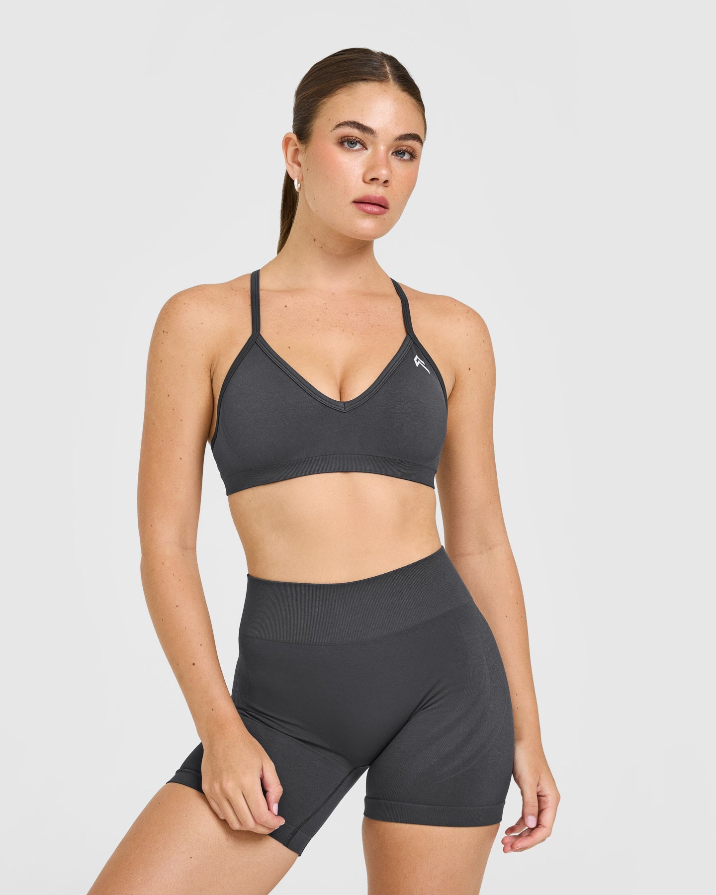 EnhanceLiftâ„¢ Seamless Strappy Sports Bra with White Logo | Coal
