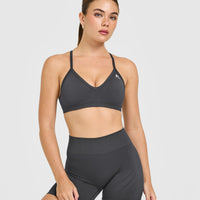 EnhanceLiftâ„¢ Seamless Strappy Sports Bra with White Logo | Coal
