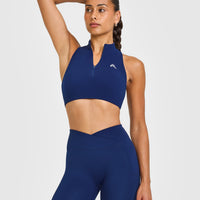 EasyLiftâ„¢ Zip High Neck Sports Bra with White Logo | Midnight