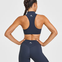 EasyLiftâ„¢ Zip High Neck Sports Bra with White Logo | True Blue