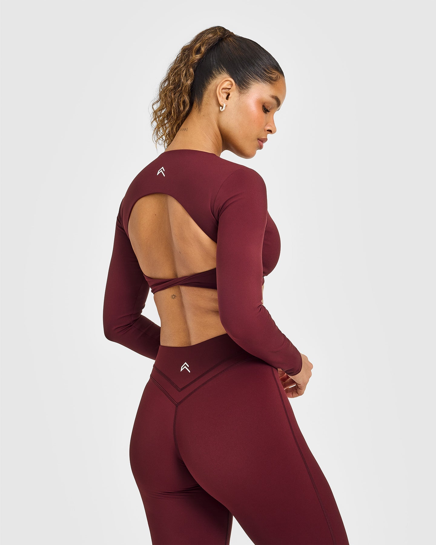 Unified Twist Front Long Sleeve Crop Top White Logo | Rosewood