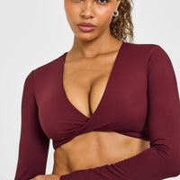 Unified Twist Front Long Sleeve Crop Top White Logo | Rosewood
