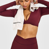 Unified Twist Front Long Sleeve Crop Top White Logo | Rosewood