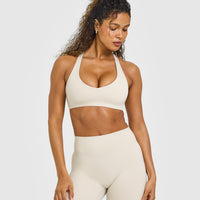 SoftMotionâ„¢ Bralette with White Logo | Sand