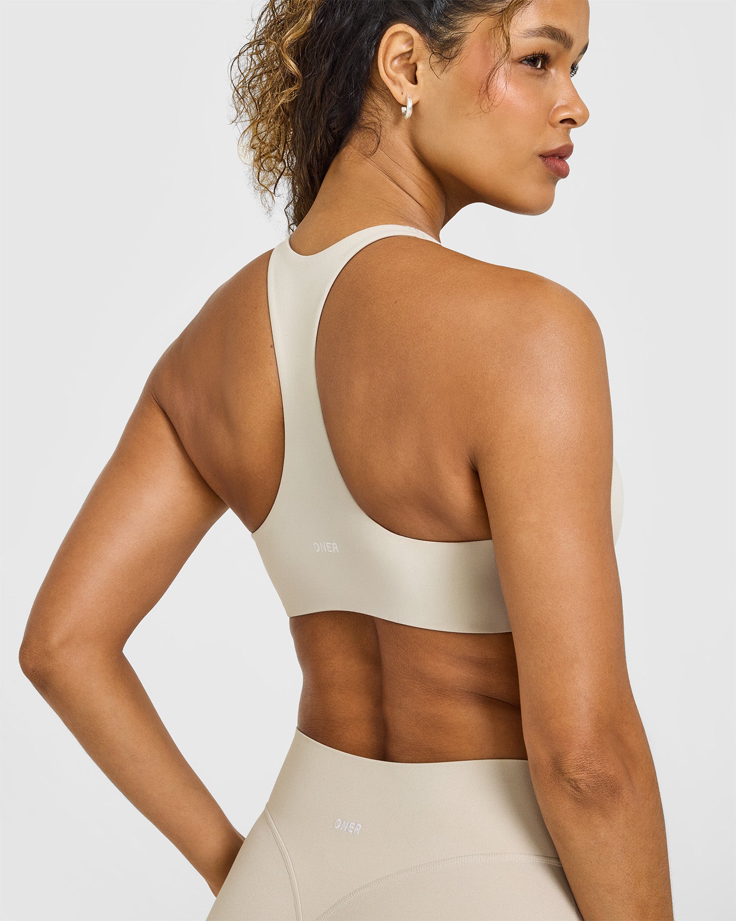 SoftMotionâ„¢ Bralette with White Logo | Sand