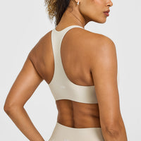 SoftMotionâ„¢ Bralette with White Logo | Sand