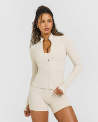 SoftMotionâ„¢ Jacket with White Logo | Sand