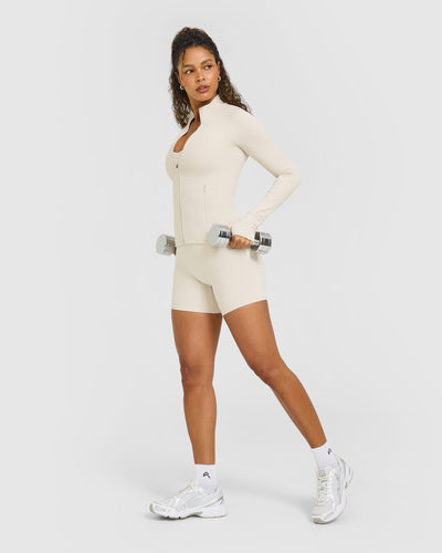 SoftMotionâ„¢ Jacket with White Logo | Sand